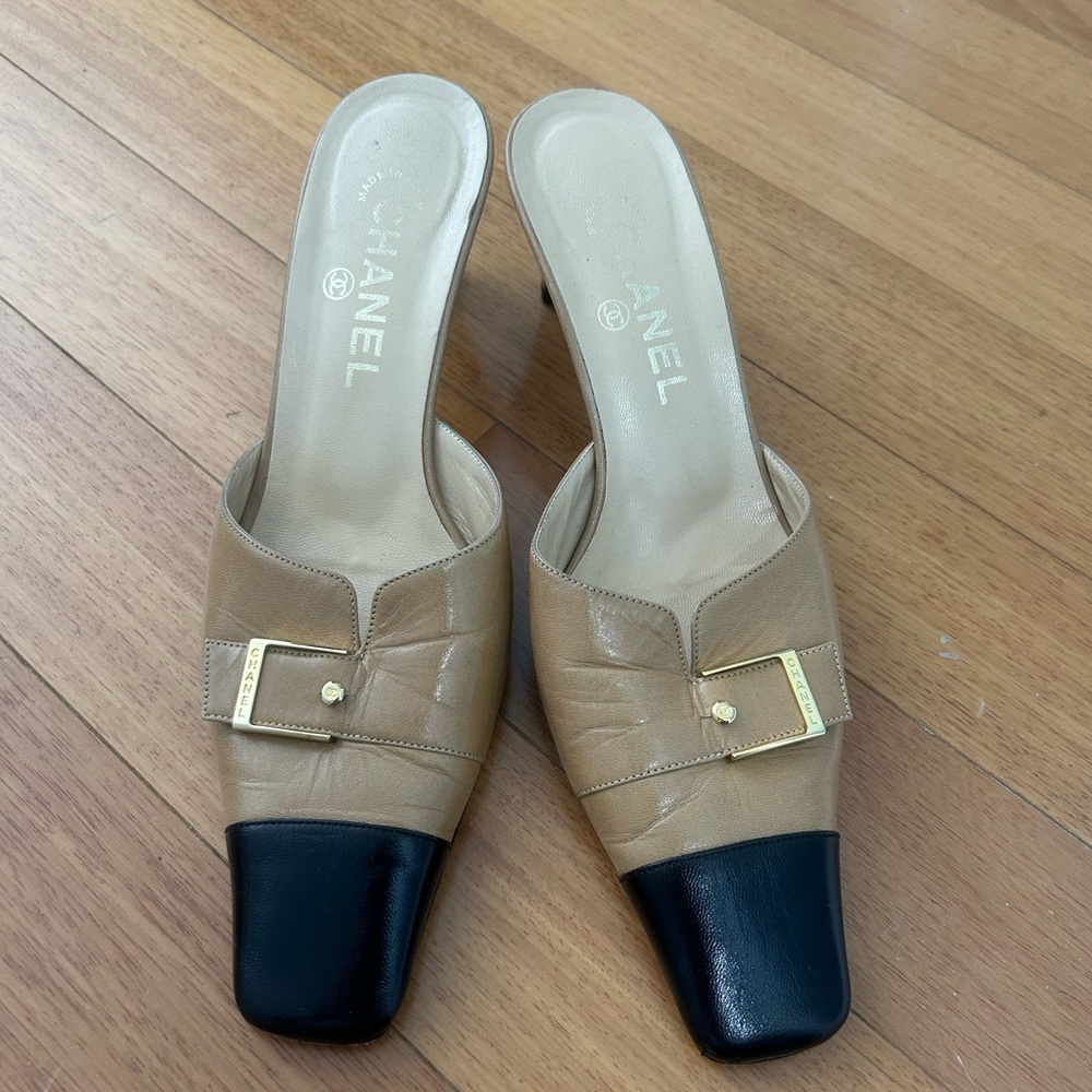 CHANEL Tan and Black Mules with Gold Buckle